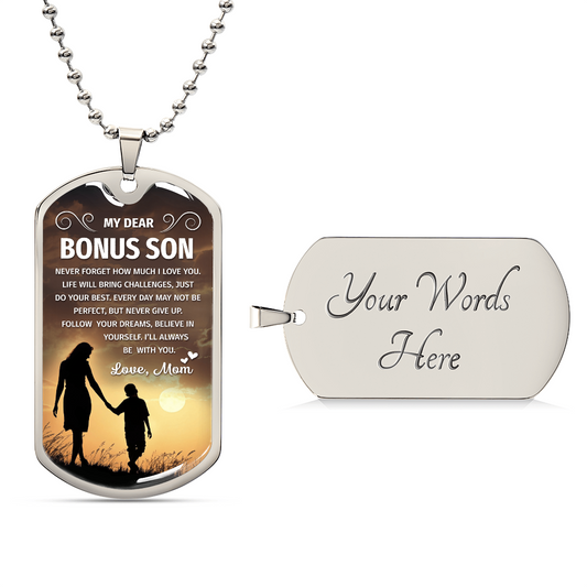 A dog tag with the words "My dear Bonus Son, love, Mom".