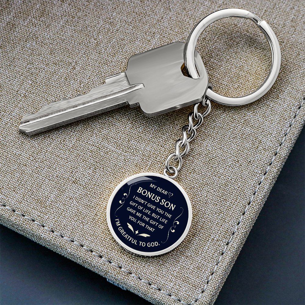"Bonus Son" keychain in a deep blue and white design.