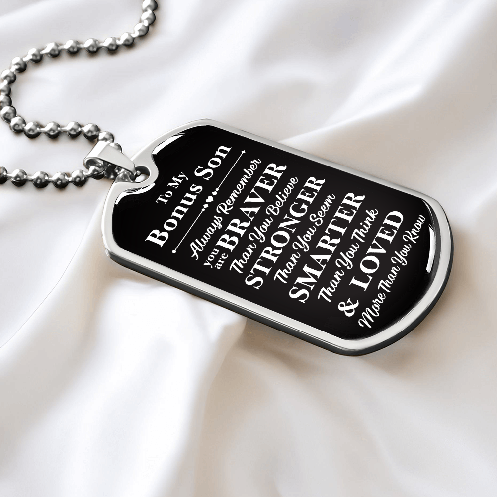 A dog tag with the words "My dear Bonus Son, love, Mom."

