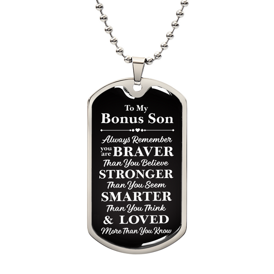 A dog tag with the words "My dear Bonus Son, love, Mom."

