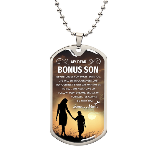 A dog tag with the words "My dear Bonus Son, love, Mom".

