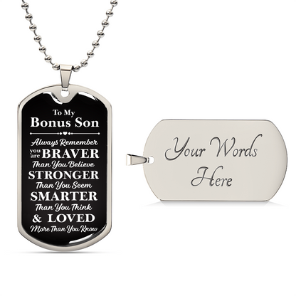 A dog tag with the words "My dear Bonus Son, love, Mom".

