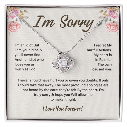 Silver Love Knot necklace in a white box