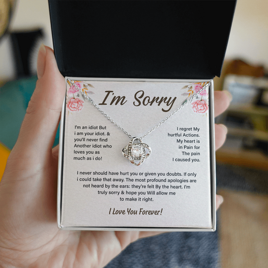 Silver Love Knot necklace in a white box