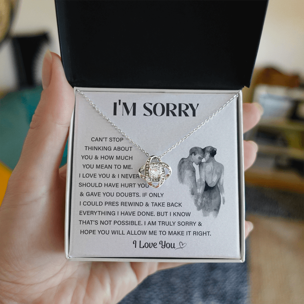 Silver Love Knot necklace in a white box