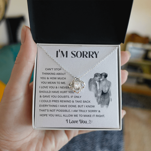 Silver Love Knot necklace in a white box