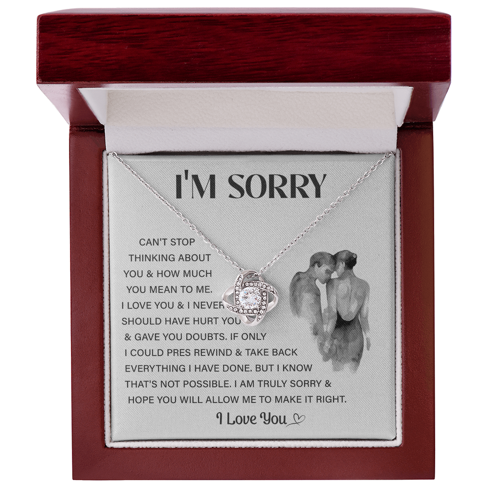 Silver Love Knot necklace in a white box
