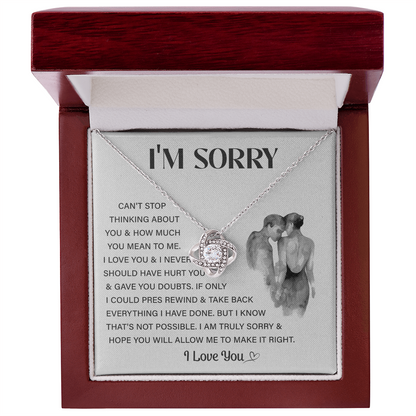 Silver Love Knot necklace in a white box