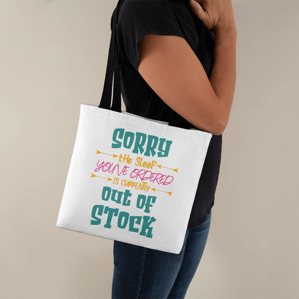 Funny canvas tote bag with red handles featuring the quote