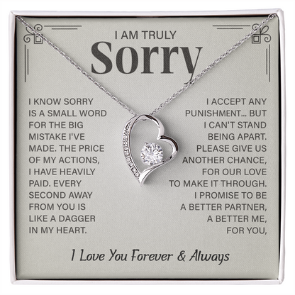 Sorry necklace in heart-shaped box.