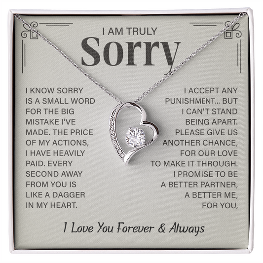 Sorry necklace in heart-shaped box.