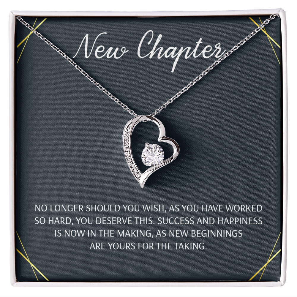 Silver open heart pendant necklace with a center stone, gifted with a "New Chapter" message.

