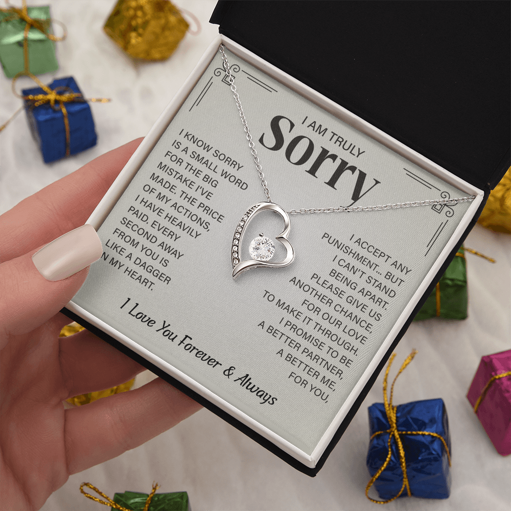 Sorry necklace in heart-shaped box.