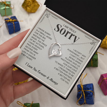 Sorry necklace in heart-shaped box.