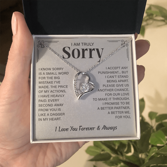 Sorry necklace in heart-shaped box.