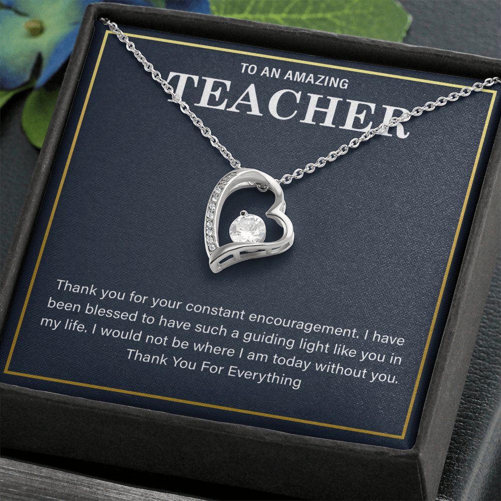 a teacher necklace with a heartfelt message card