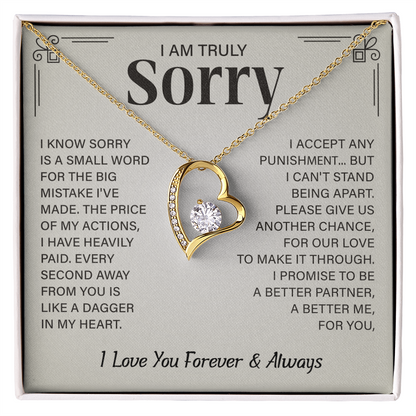 Sorry necklace in heart-shaped box.