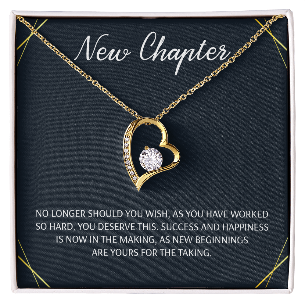 Silver open heart pendant necklace with a center stone, gifted with a "New Chapter" message.


