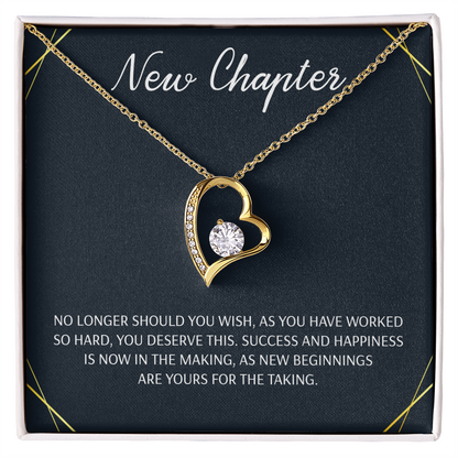 Silver open heart pendant necklace with a center stone, gifted with a "New Chapter" message.

