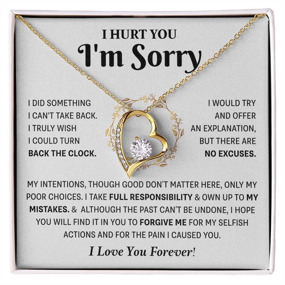 gold Love Knot necklace in a white box