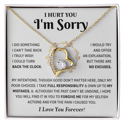 gold Love Knot necklace in a white box