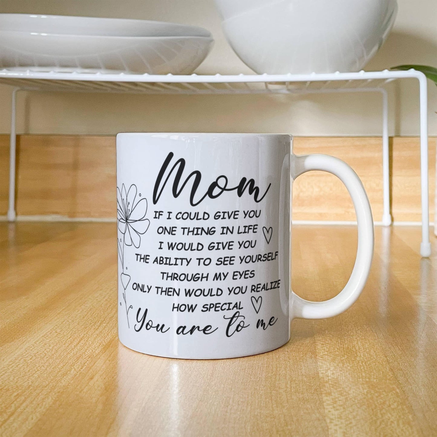 White ceramic mug with a heartfelt message for moms.