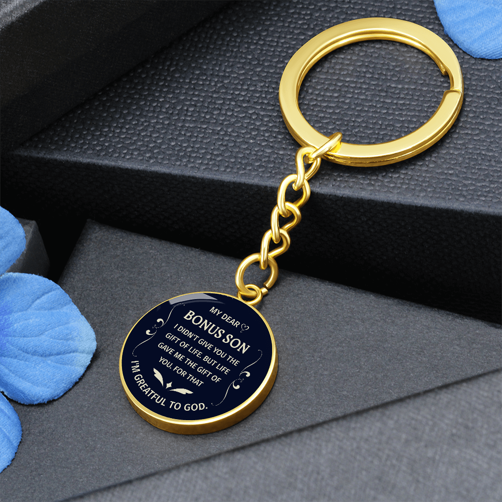 "Bonus Son" keychain in a deep blue and white design.

