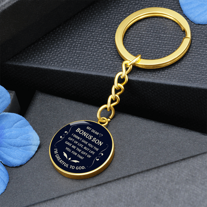"Bonus Son" keychain in a deep blue and white design.


